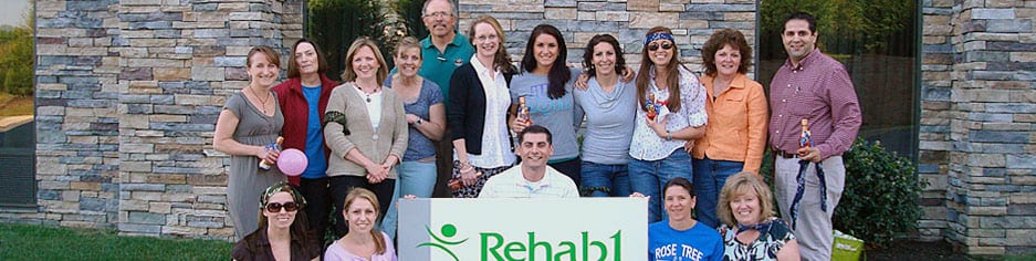 Rehab1 team standing infront of building